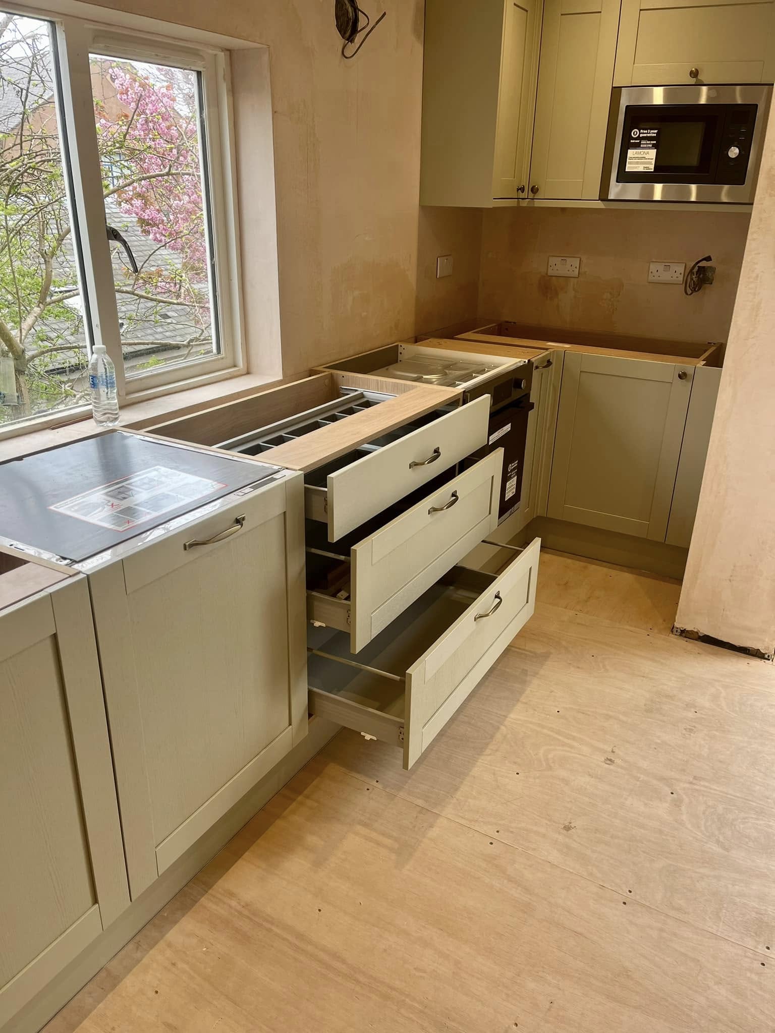 Bespoke kitchen in Edinburgh with integrated storage, elegant finishes, and LED lighting by SJC Joinery (Scot) Ltd