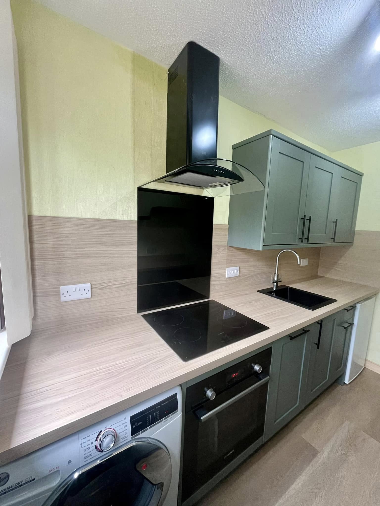 Handcrafted kitchen in Edinburgh home with ambient lighting and durable worktops