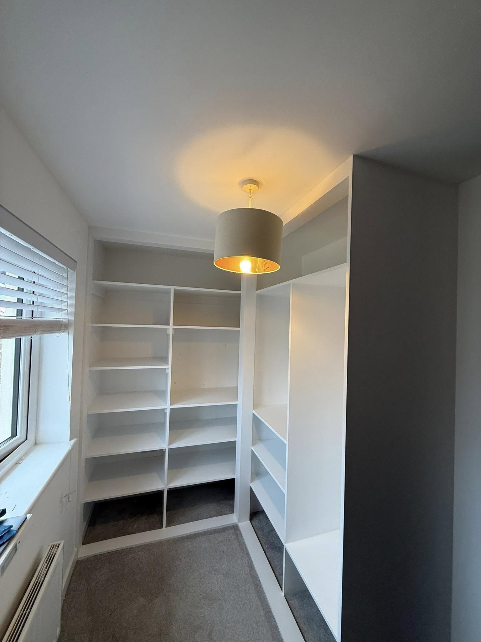 Modern fitted wardrobe design in Edinburgh home maximizing storage space