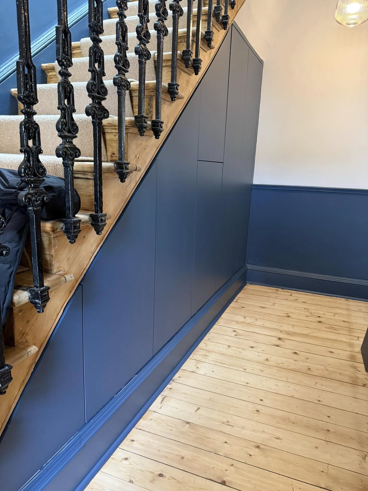 Modern fitted wardrobe design in Edinburgh home maximizing storage space
