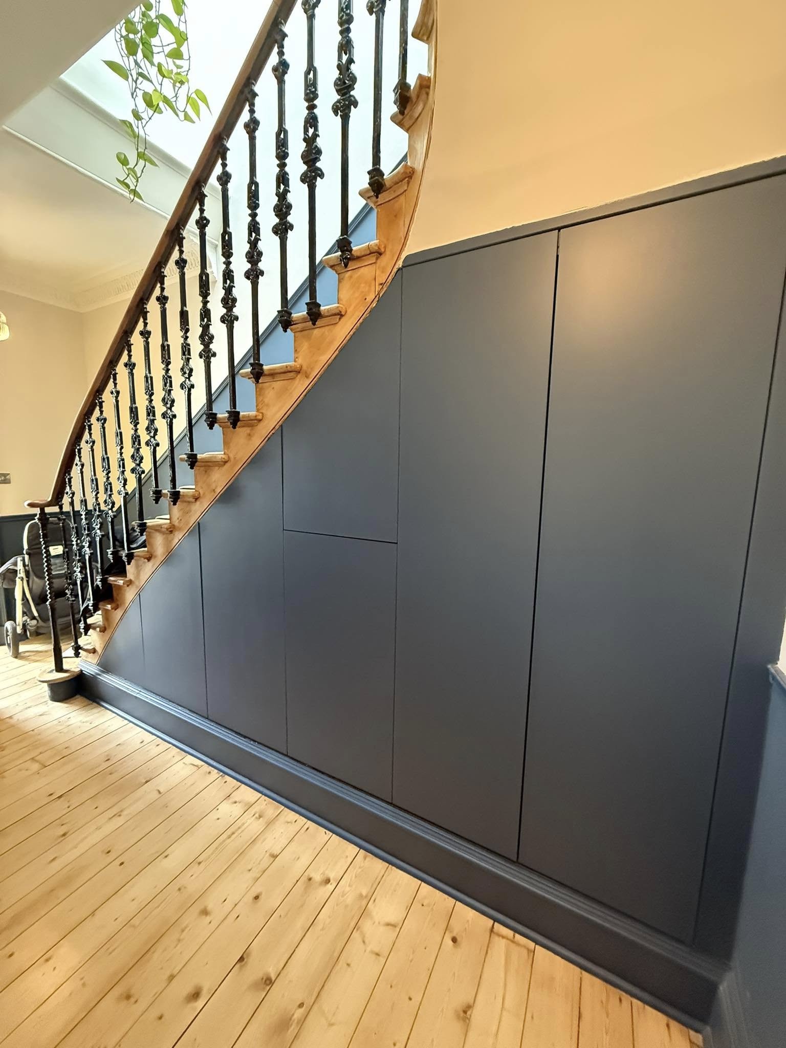 Bespoke wardrobe in Edinburgh bedroom with custom shelving and sliding doors by SJC Joinery (Scot) Ltd lighting