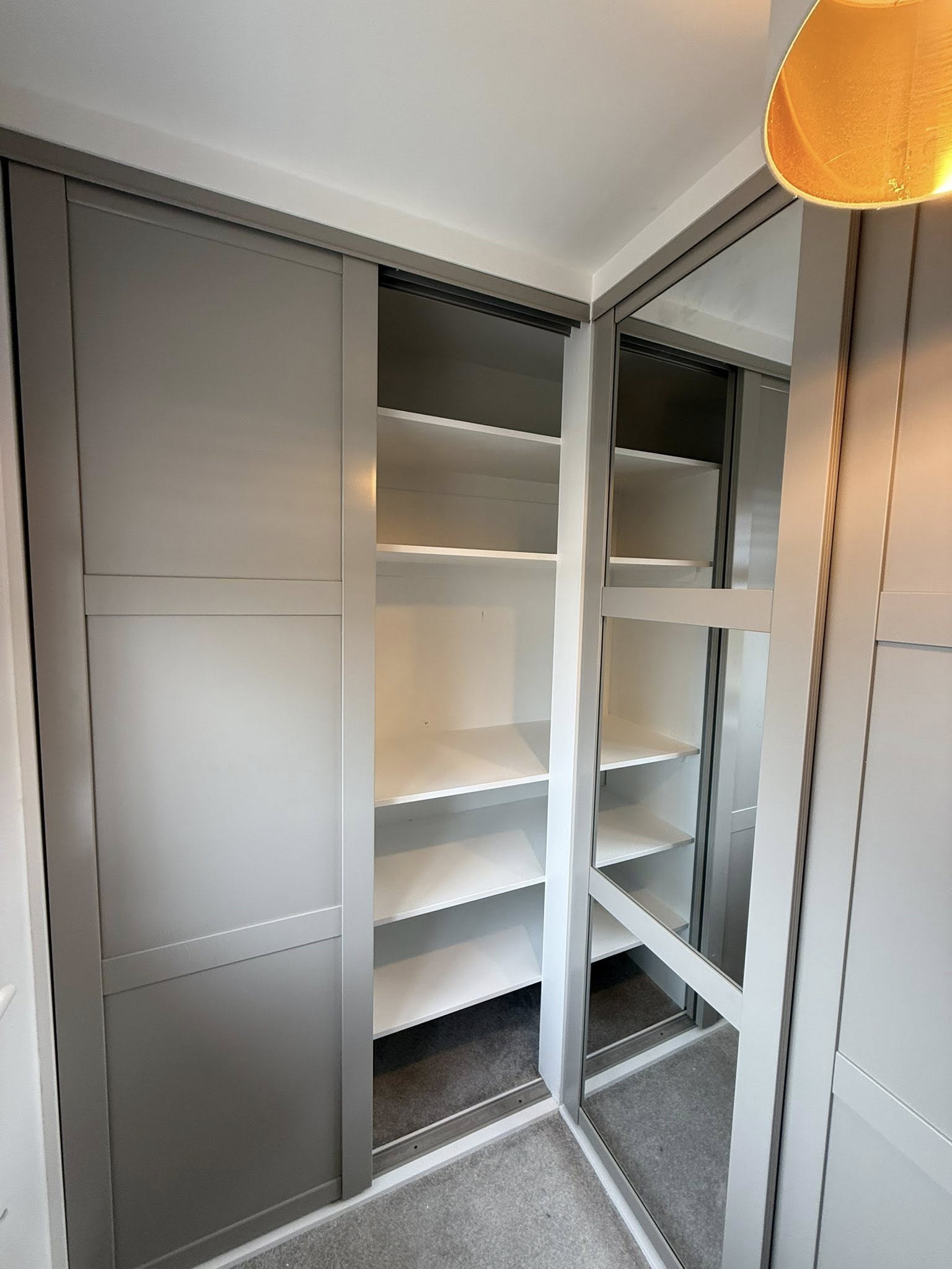 Modern fitted wardrobe design in Edinburgh home maximizing storage space