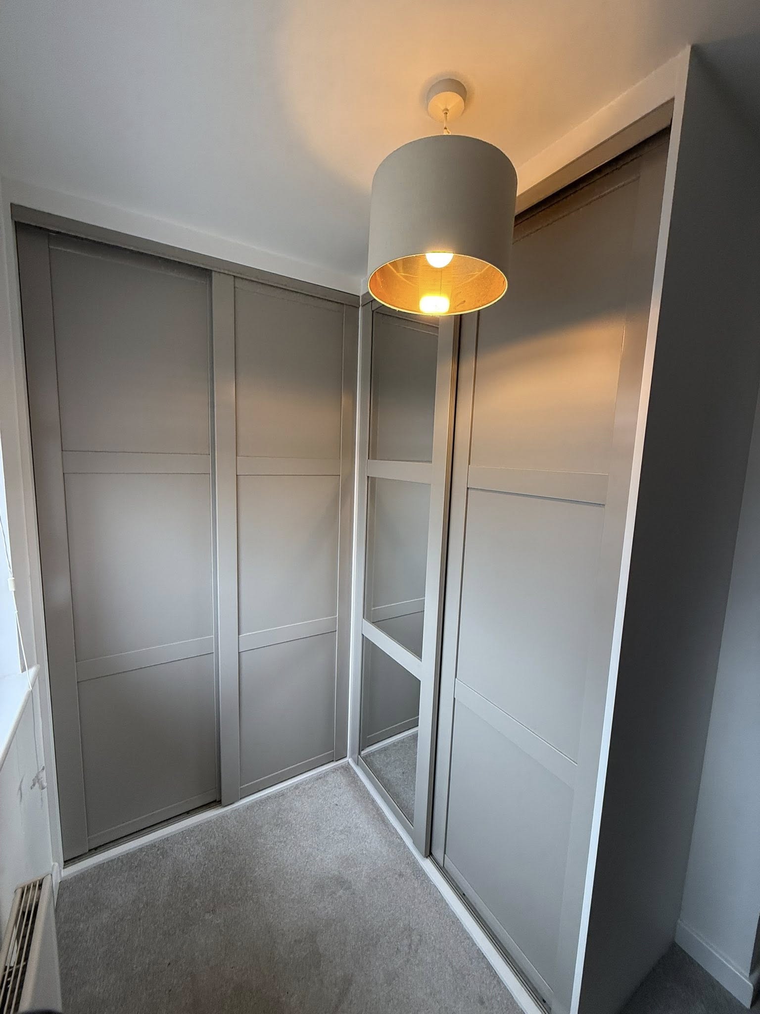 Modern fitted wardrobe design in Edinburgh home maximizing storage space