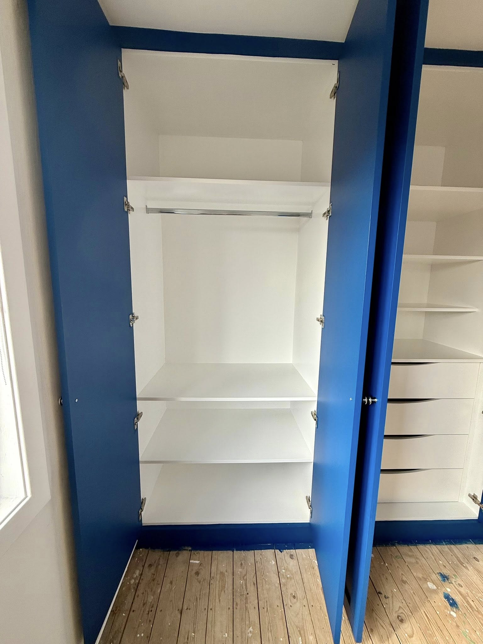 Modern fitted wardrobe design in Edinburgh home maximizing storage space