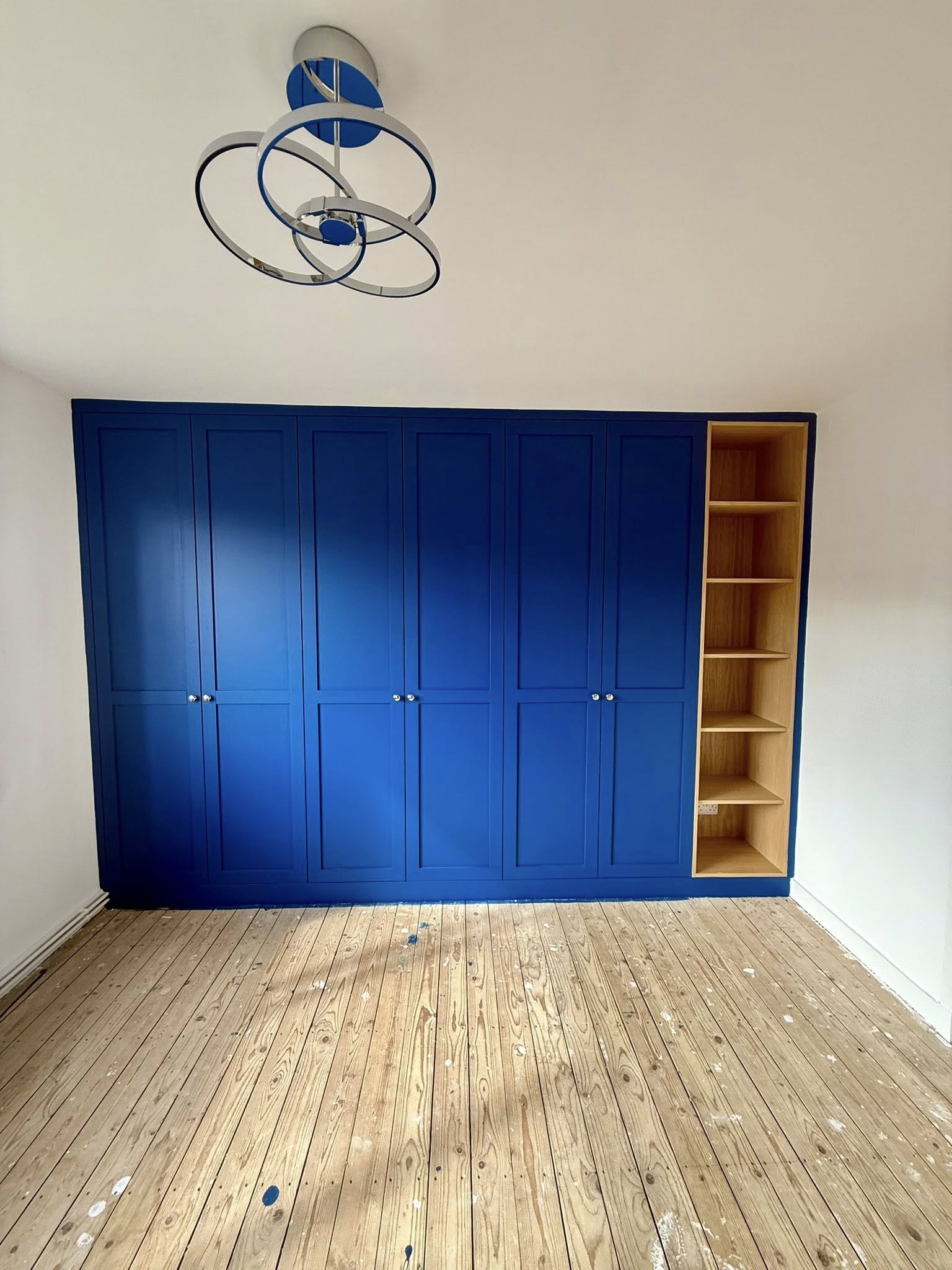 Tailored bedroom wardrobe in Edinburgh with organized shelves and hanging space