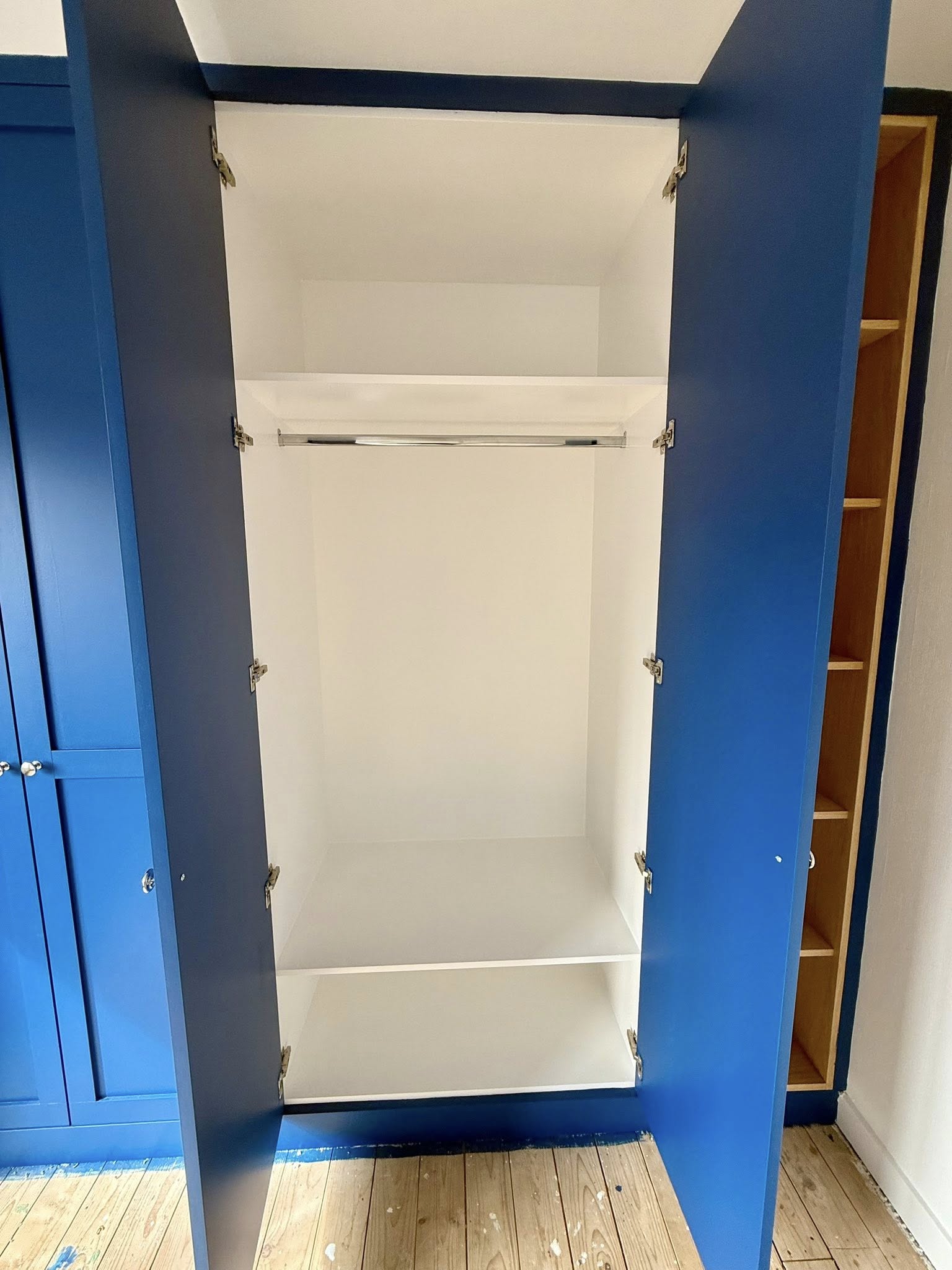Modern fitted wardrobe design in Edinburgh home maximizing storage space