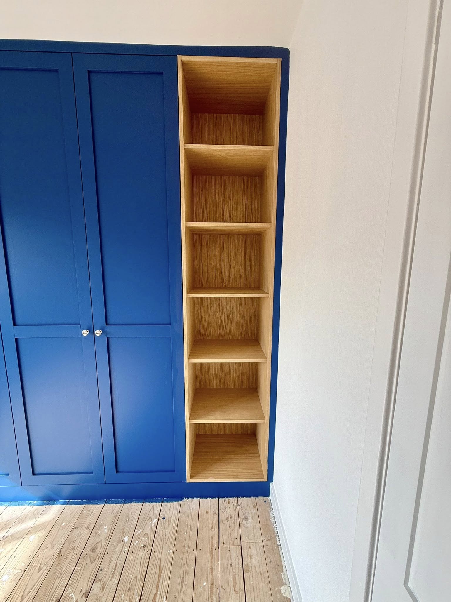 Tailored bedroom wardrobe in Edinburgh with organized shelves and hanging space