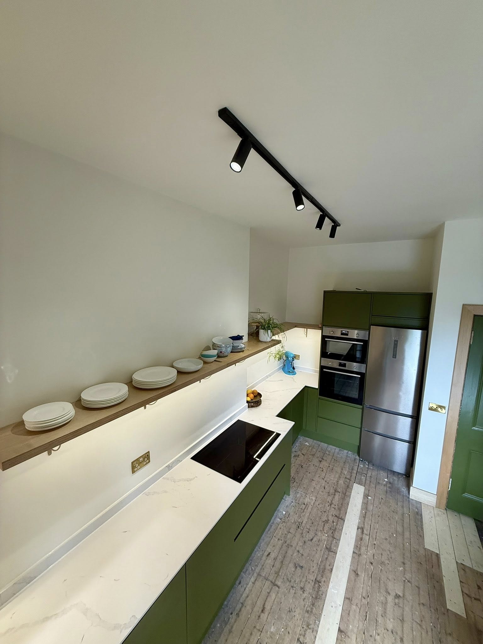 Modern kitchen design in Edinburgh with practical layout and stylish under-cabinet lighting